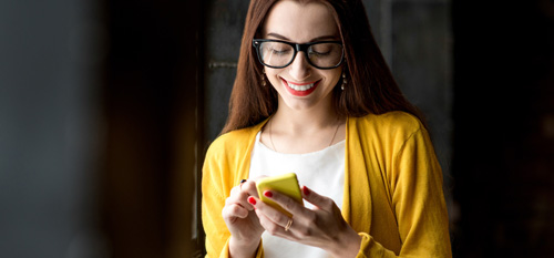 Two young women taking a selfie photo