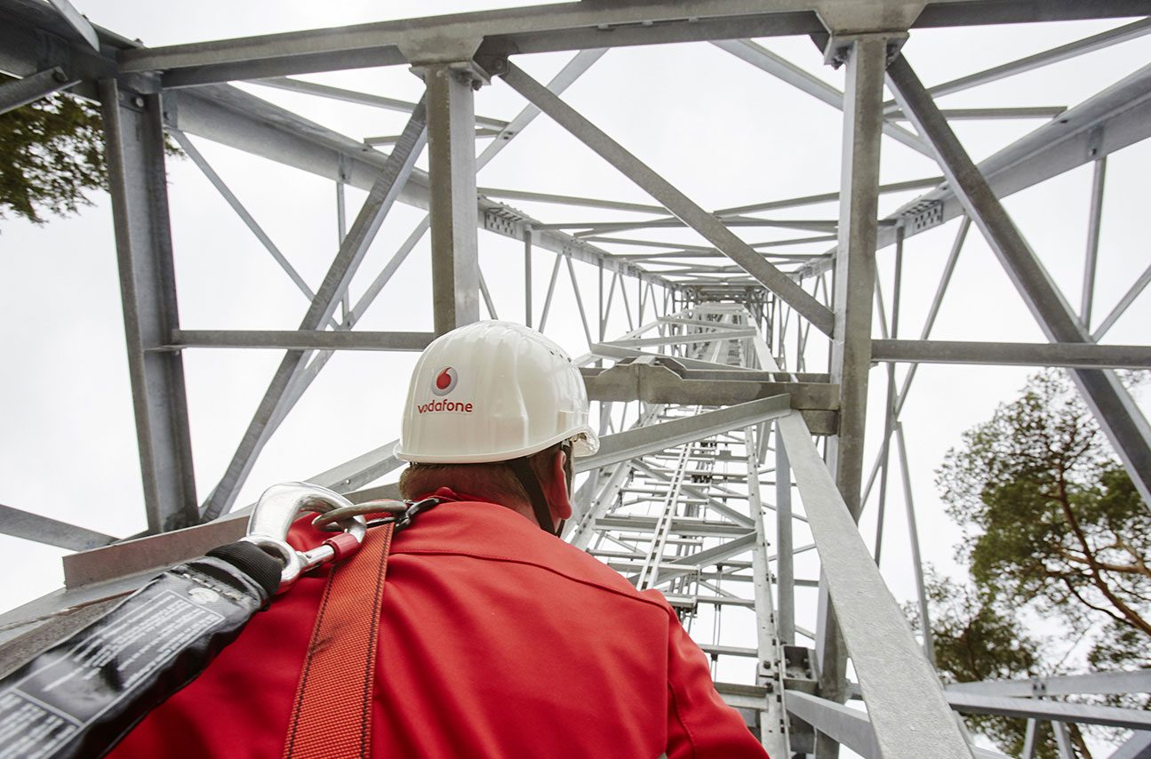 A Vodafone engineer at a network mast