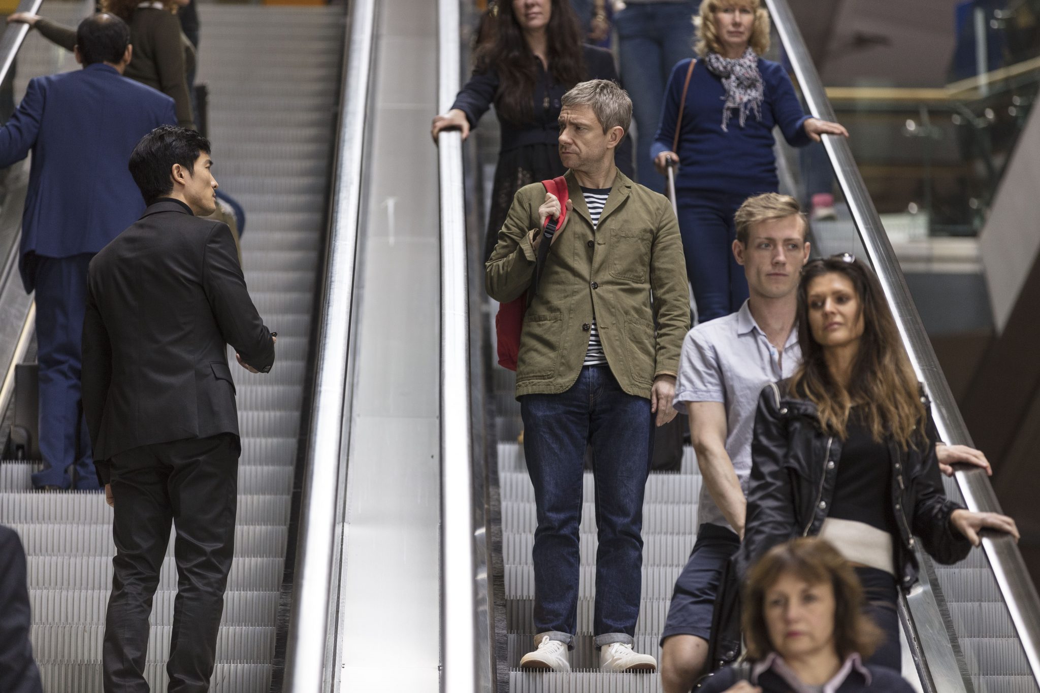 Martin Freeman is spotted by a mysterious stranger while going down an escalator