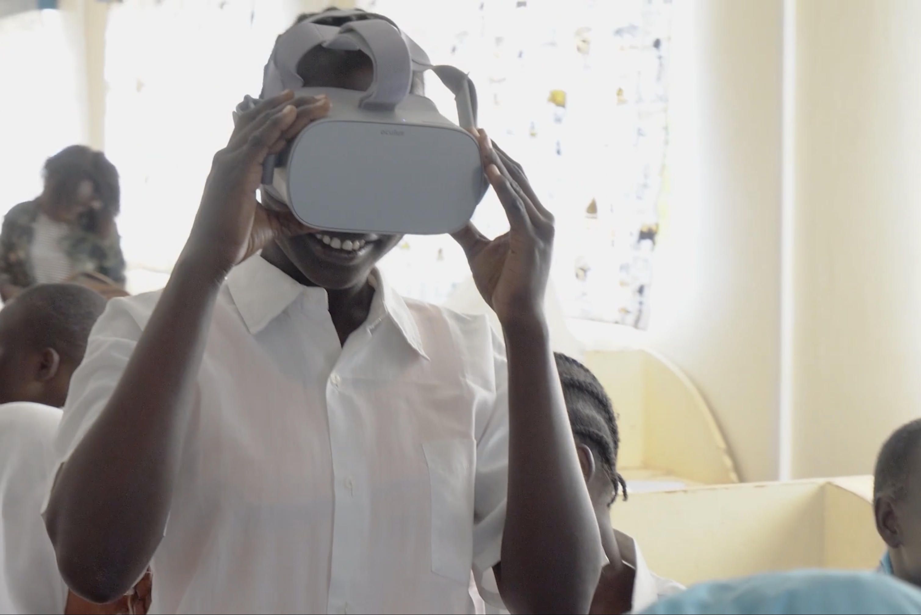 Image of a woman using a VR headset in Kakuma, Kenya.