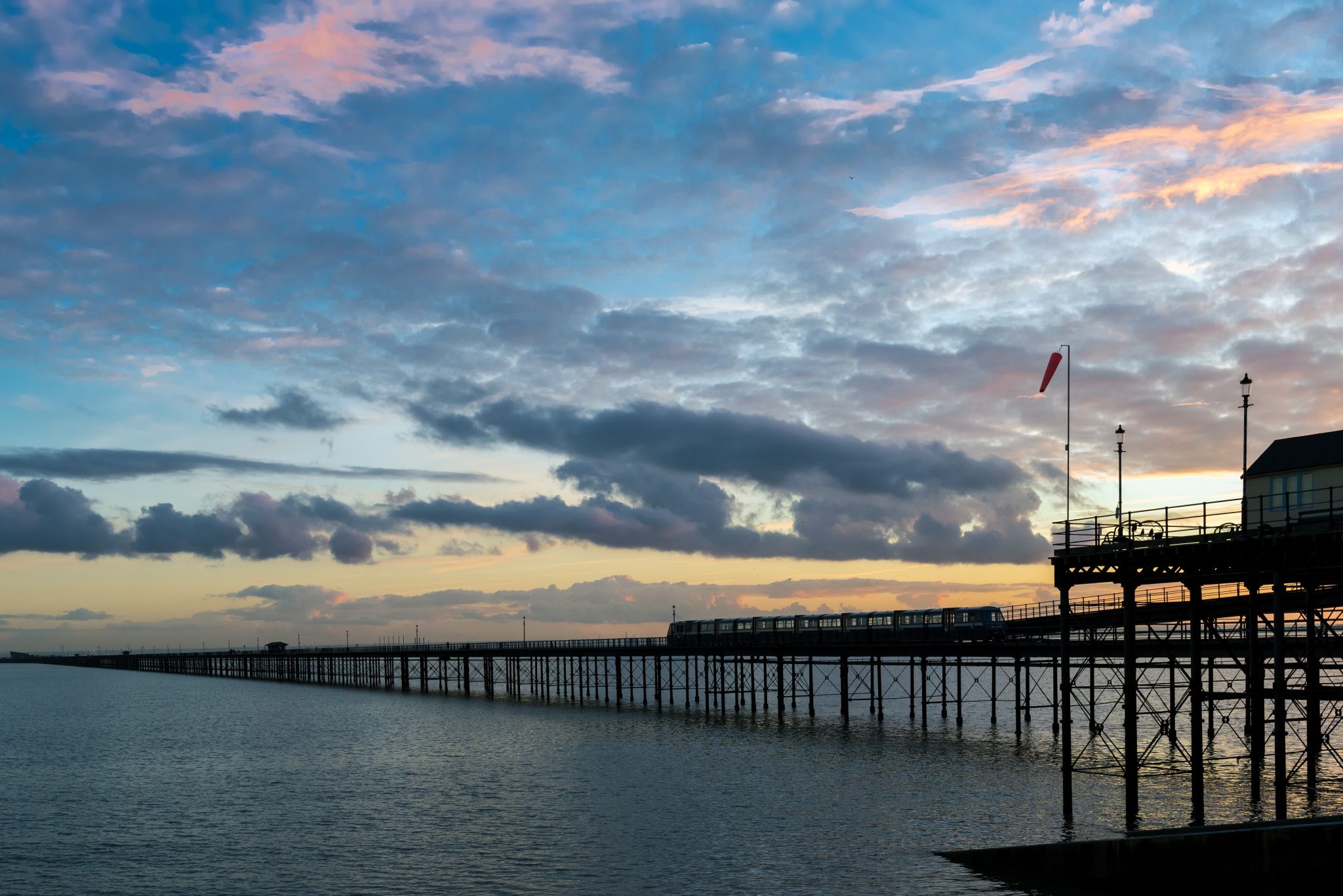 Southend pier at sunset with train