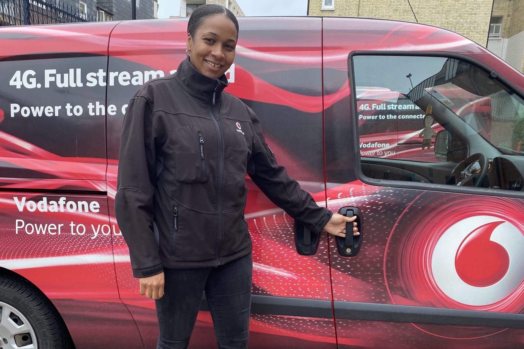 Natasha Carpenter Vodafone UK engineer standing in front of van
