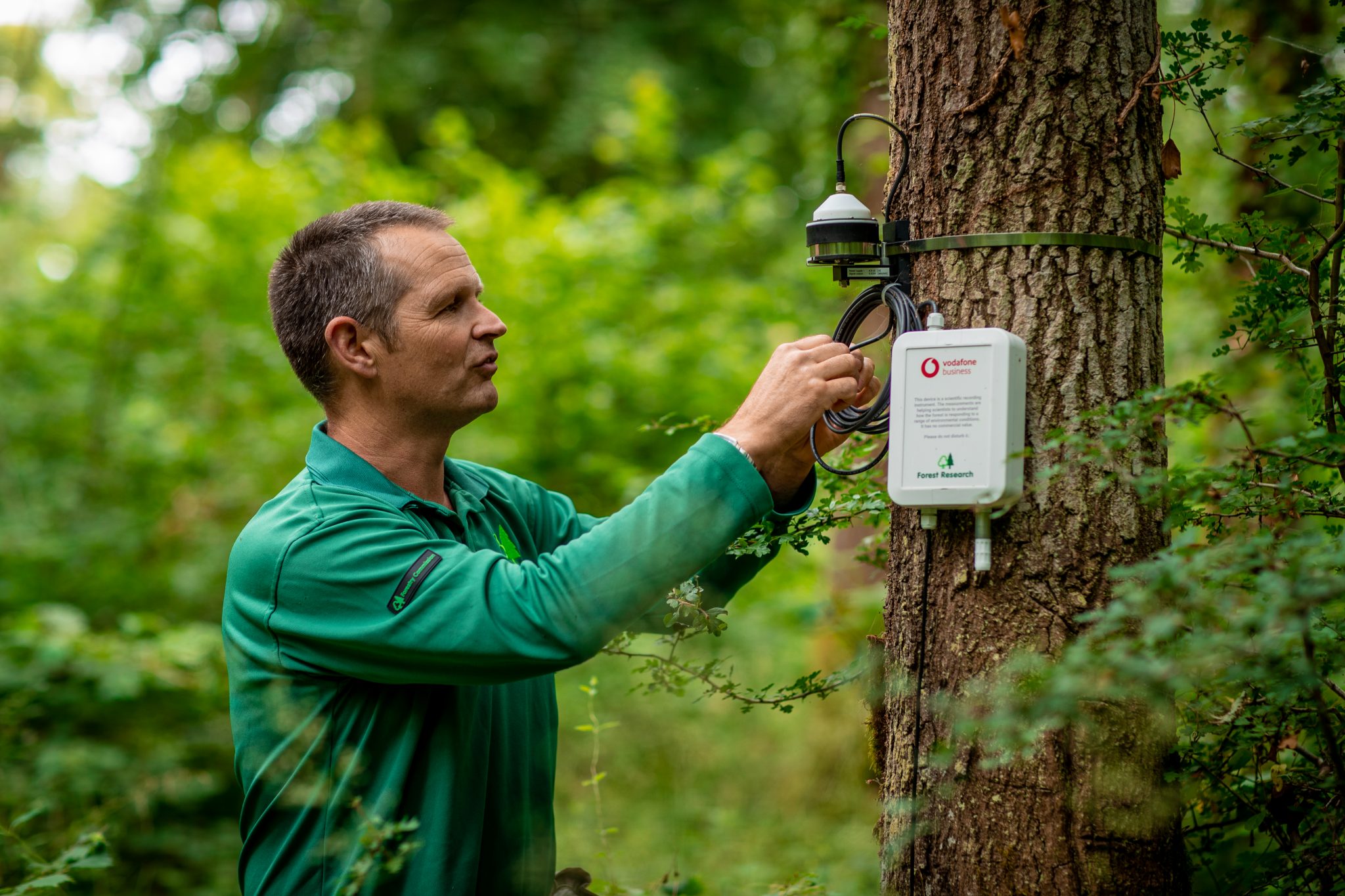 photo of Matthew Wilkinson and a Vodafone IoT sensor