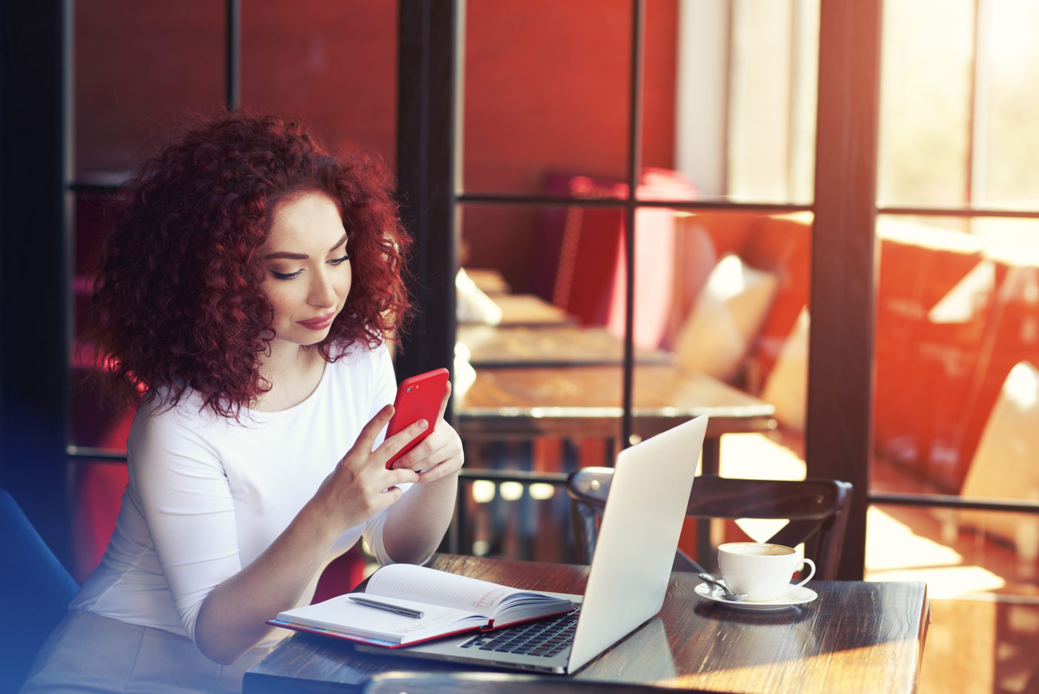 Young Woman in Cafe Red Phone