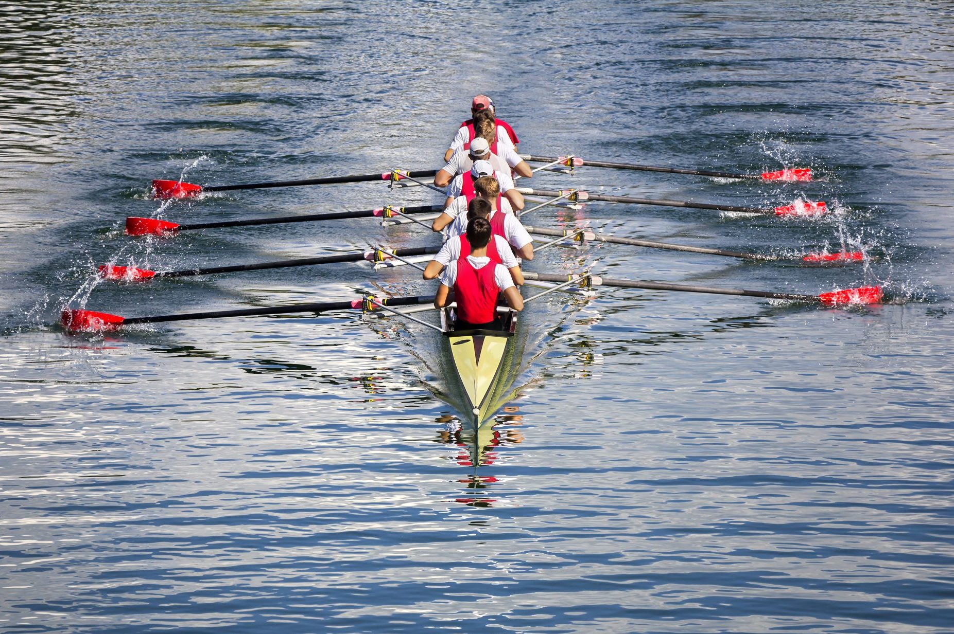 Rowing eight on lake