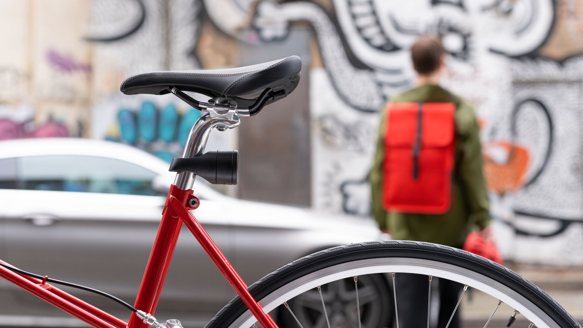 an image of the Vodafone Curve Bike tracker on a bicycle with a cyclist walking away into the background