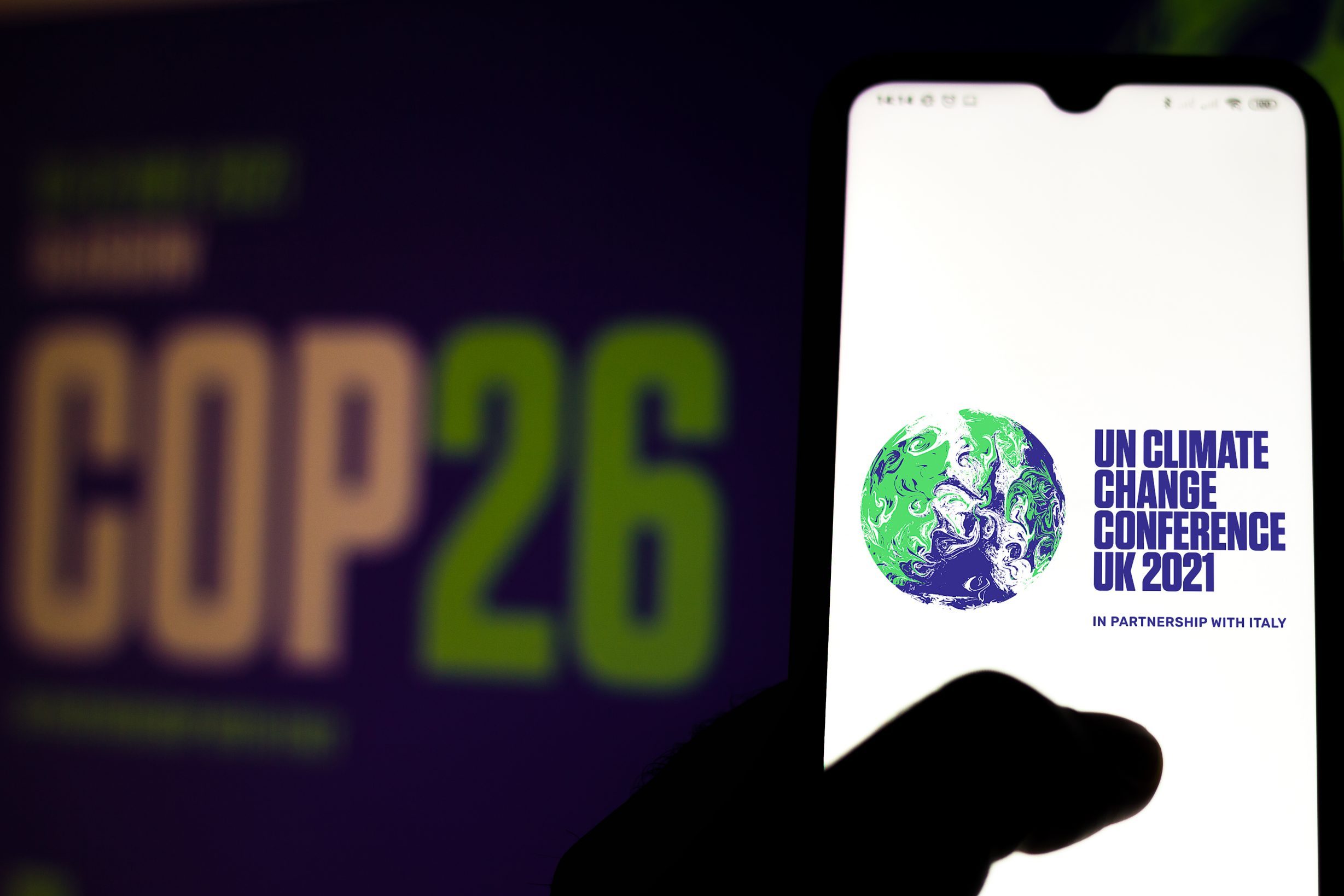COP26 conference banner and smartphone app