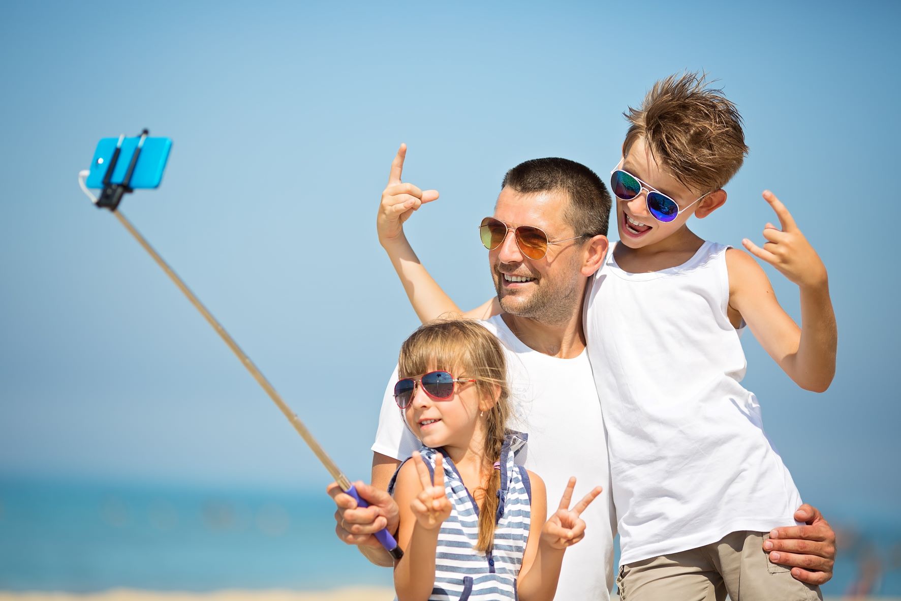 Dad & kids taking a summer fun selfie