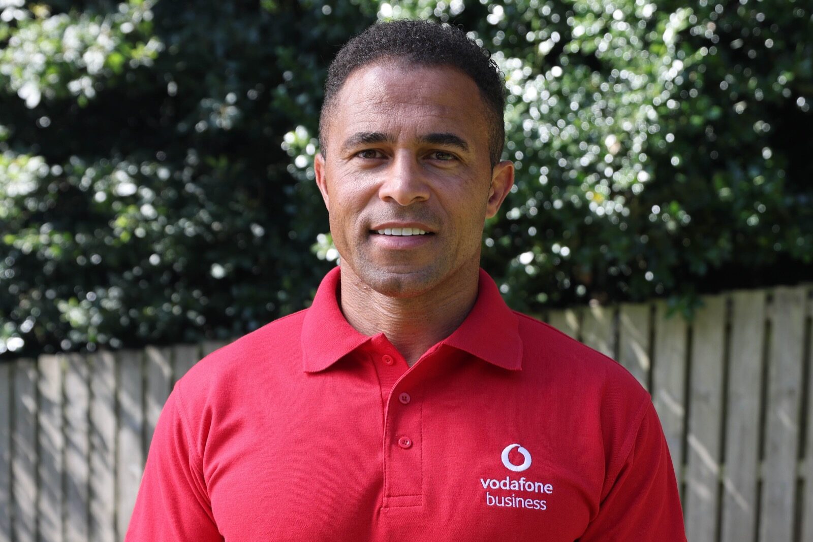 photo of James Robinson outside wearing a Vodafone polo shirt