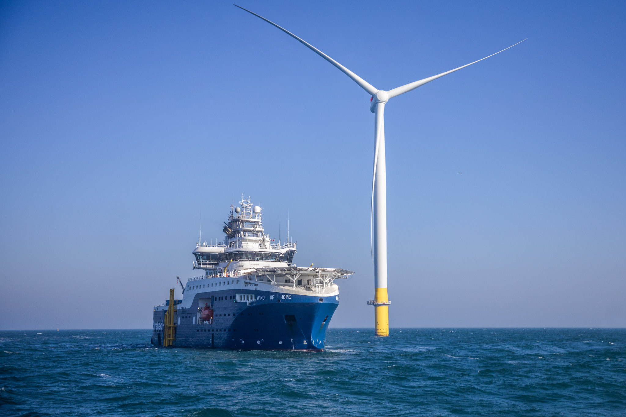 a ship alongside an offshore wind turbine, Hornsea