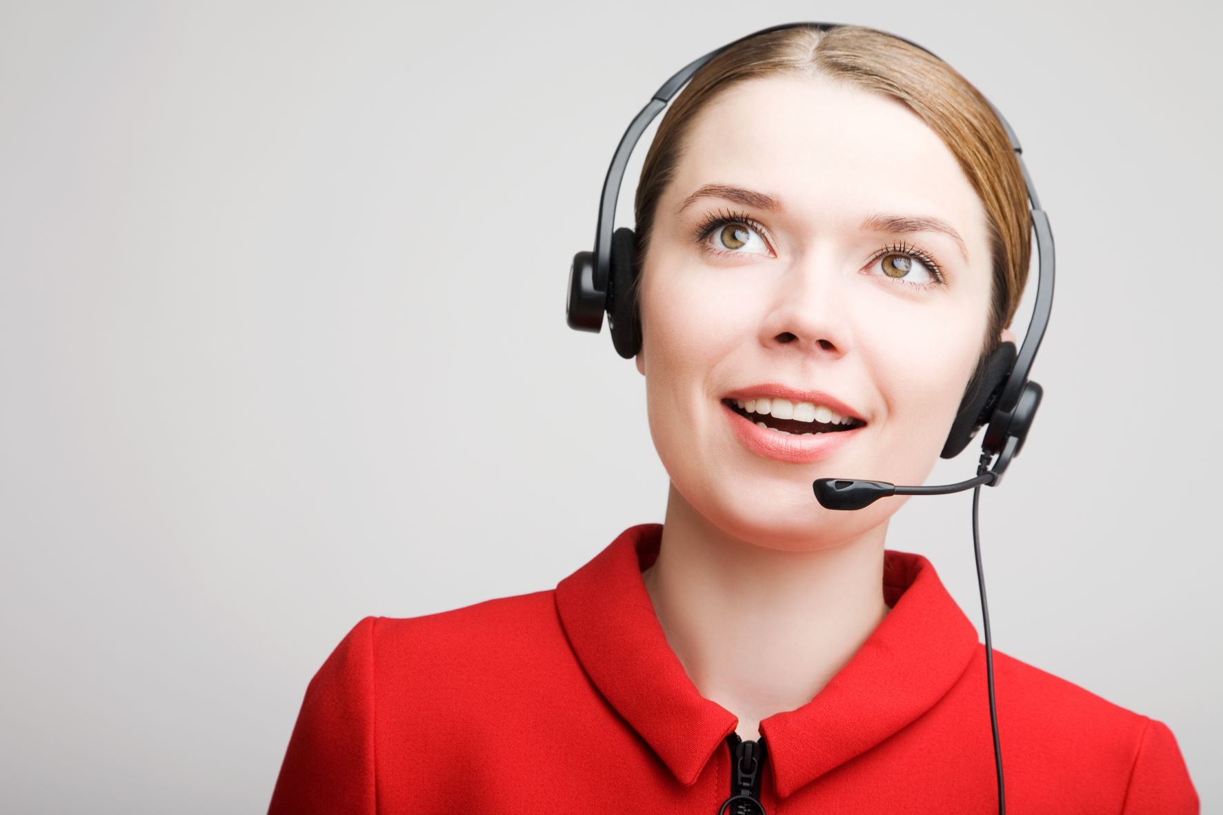 Smiling customer care woman wearing headset