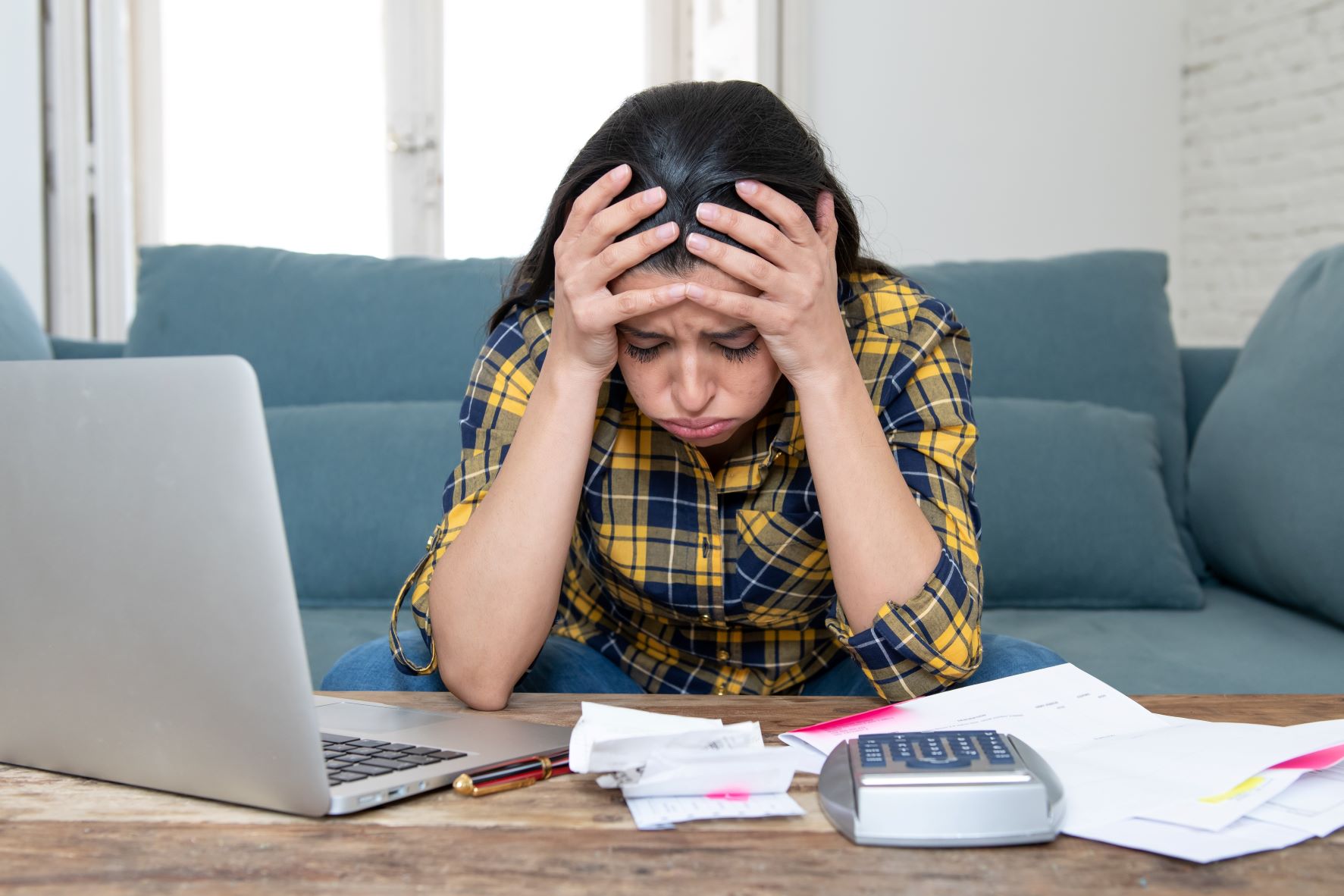 Stressed young woman facing debts