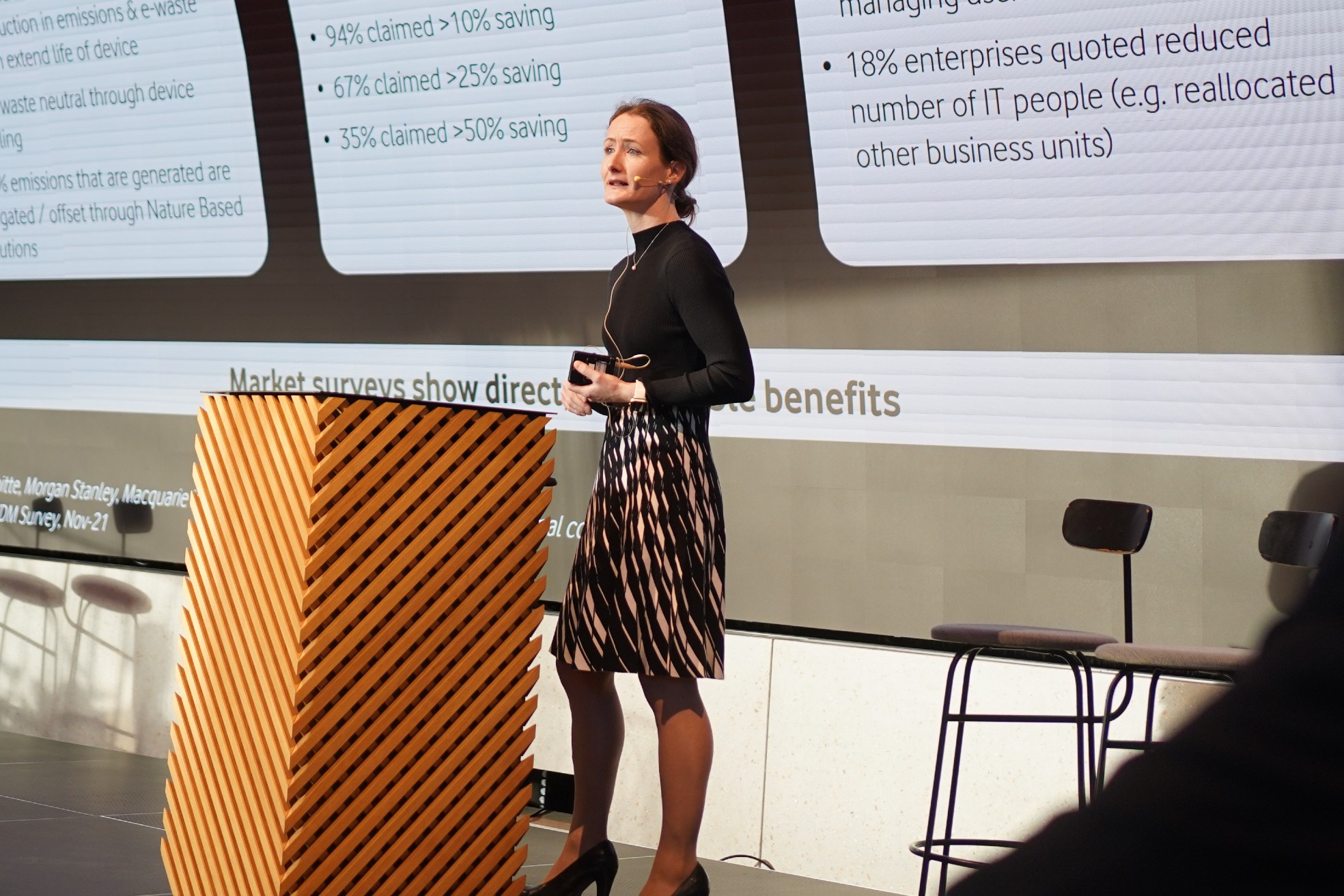 photo of Ceri Tinine, Senior Strategy Manager at Vodafone Business, speaking from a lectern to potential corporate customers at an event