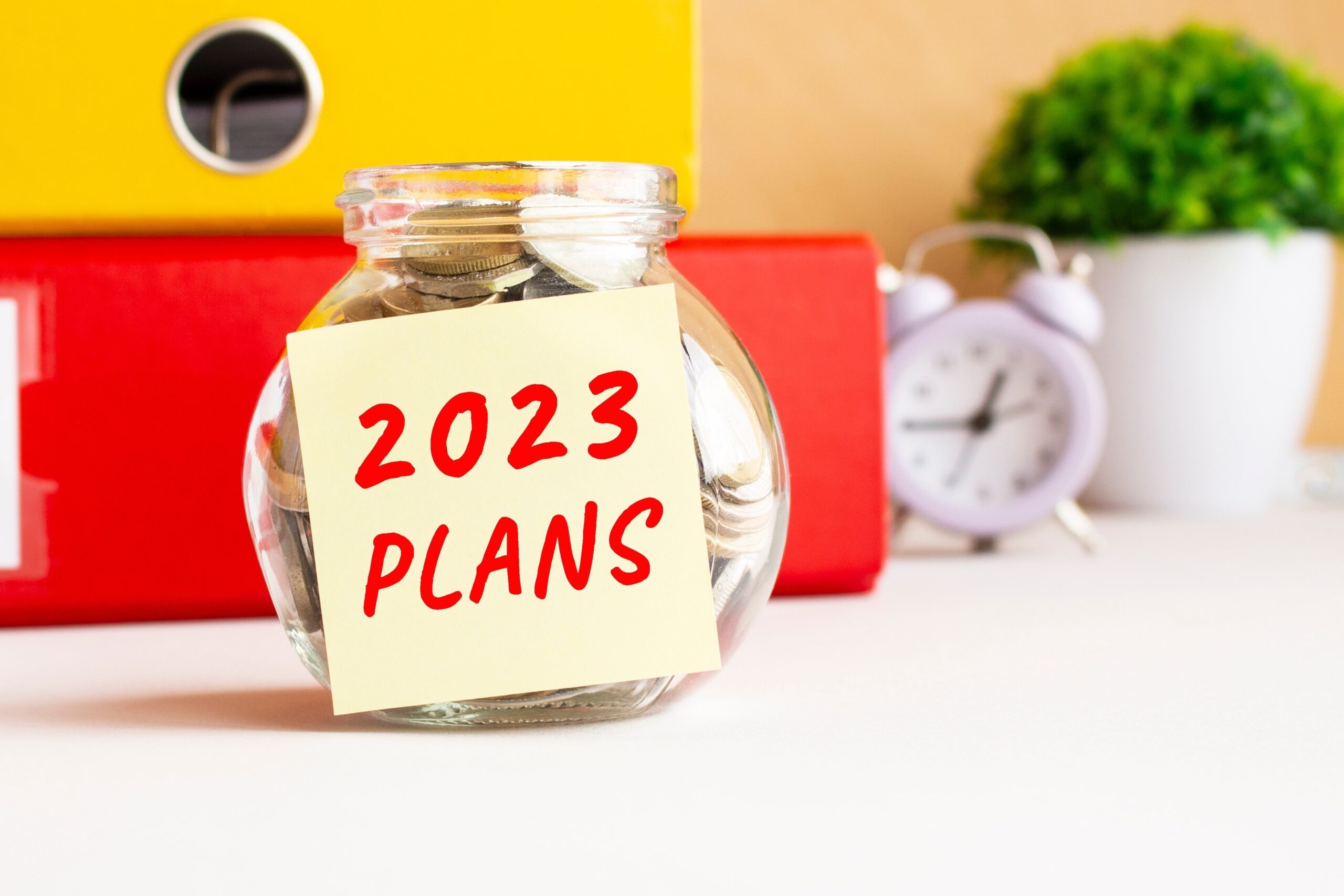'2023 Plans' post-it note on money jar