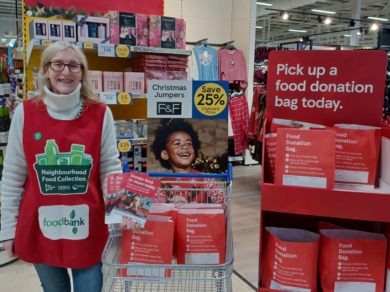 Cathy Fitzgerald, Vodafone employee, volunteering for the Trussell Trust food bank charity at a Tesco store