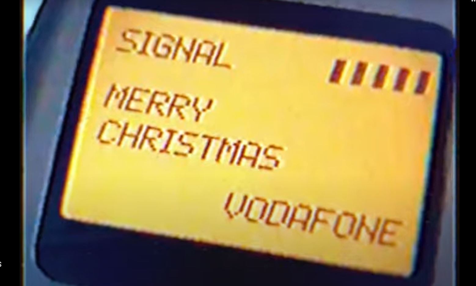 Close up of the first text message saying 'MERRY CHRISTMAS' on the Orbitel 901 phone