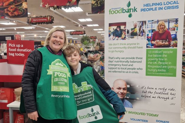 Vodafone employee Sonia Leijenaar and her nephew volunteering for the Trussell Trust food bank charity at a Tesco store