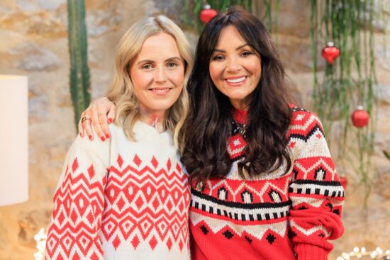 photo of Tanja Bage and Martine McCutcheon in Christmas jumpers