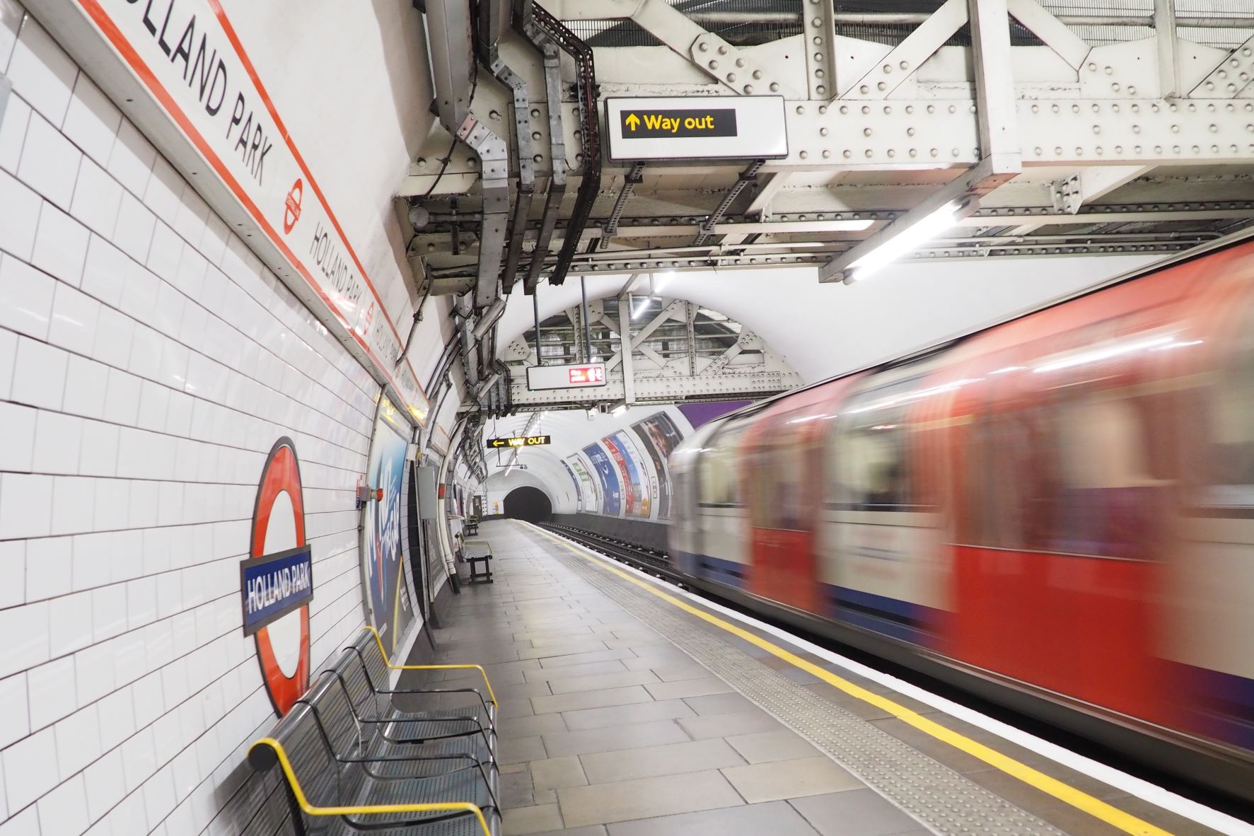Tube train leaving Holland Park Station (Editorial use only)