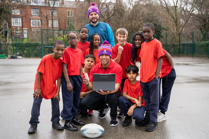 Ex-rugby winger Jason Robinson at Bankside Primary in Leeds with PE teacher Will Lancaster and children.