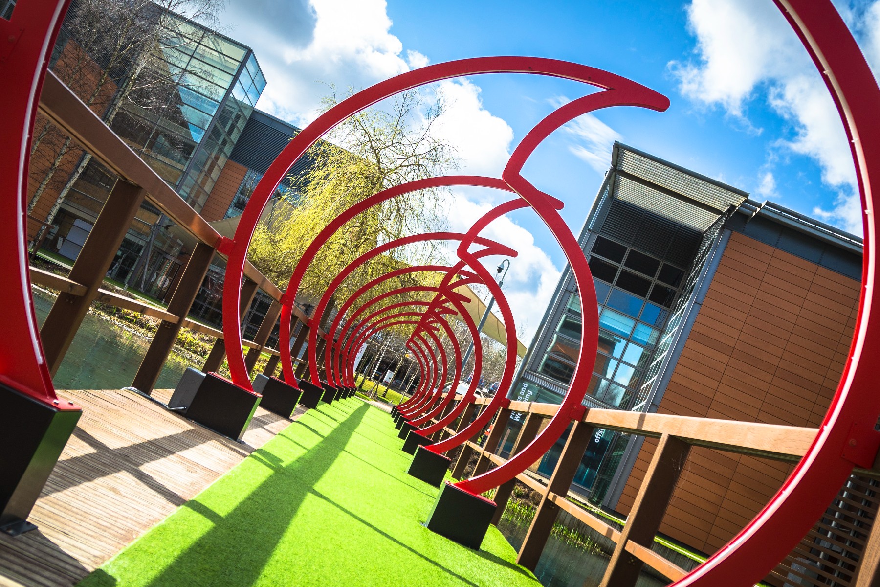 photo of a bridge across a pond at Vodafone's UK headquarters in Newbury, Berkshire