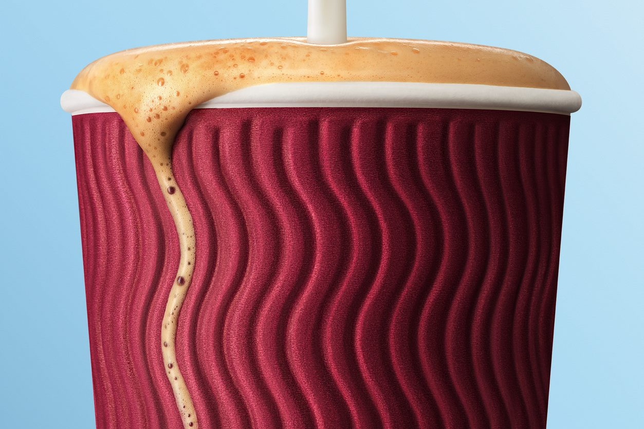 illustrative image of an overflowing coffee cup
