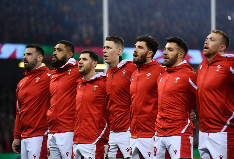 photo of Welsh male rugby players lined up on a pitch