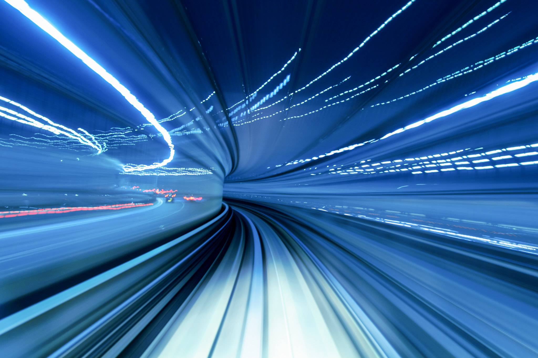 stock photo of generic whizzy blue lines intended to evoke concepts of speed