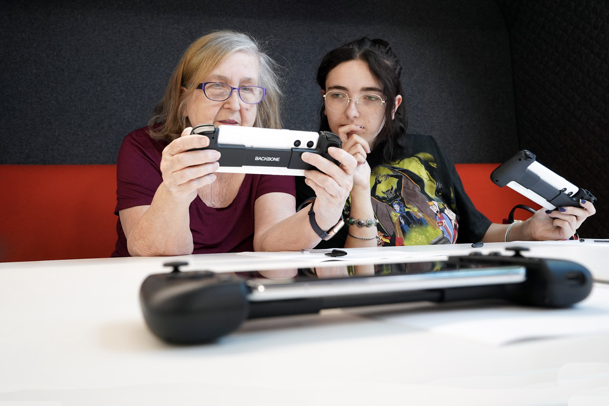 photo showing a grandmother and granddaughter participating in the 5GSA network slice for cloud gaming trial at Coventry University, July 2023
