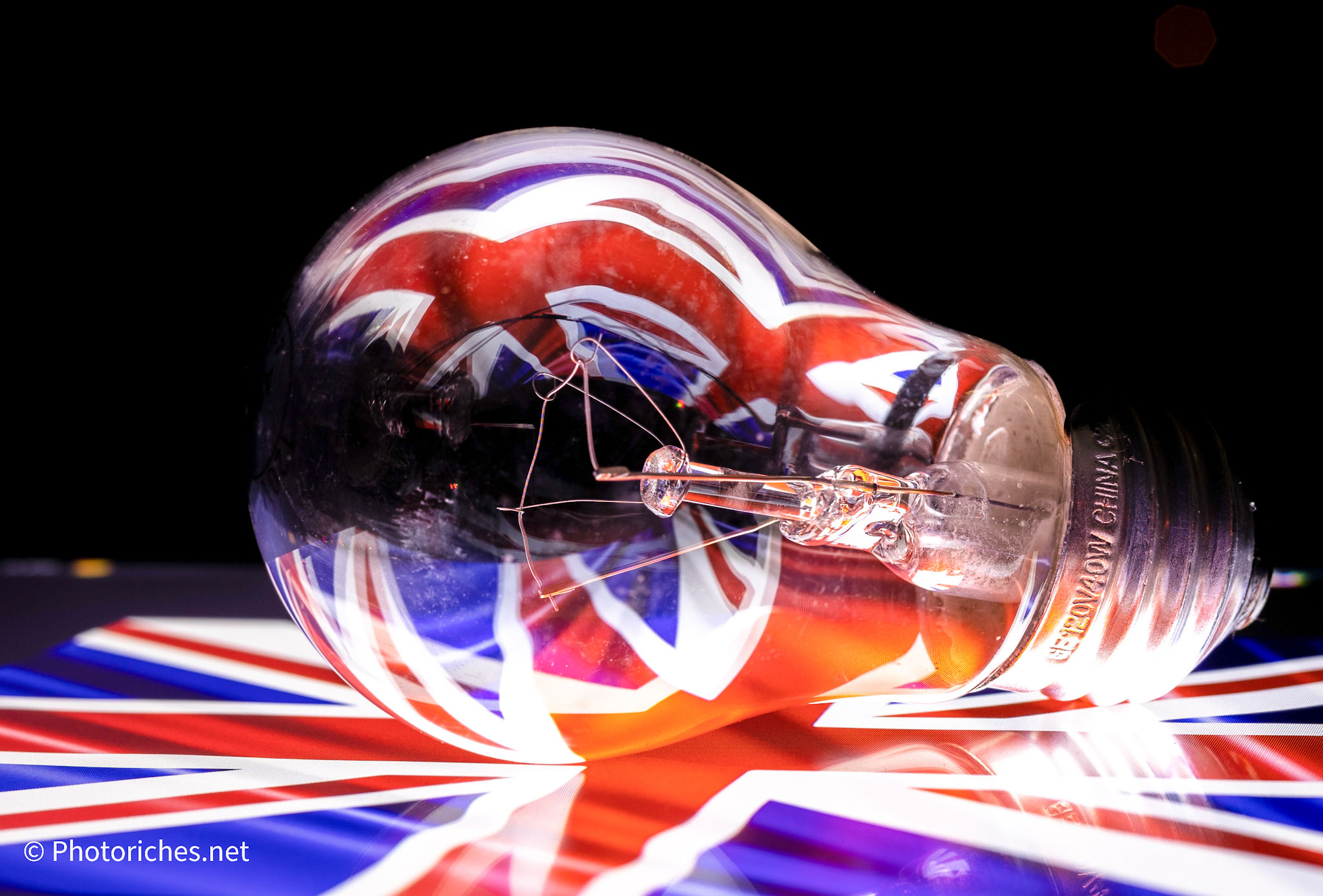 stock image of the Union Jack displayed on a tablet screen then reflected in a lightbulb