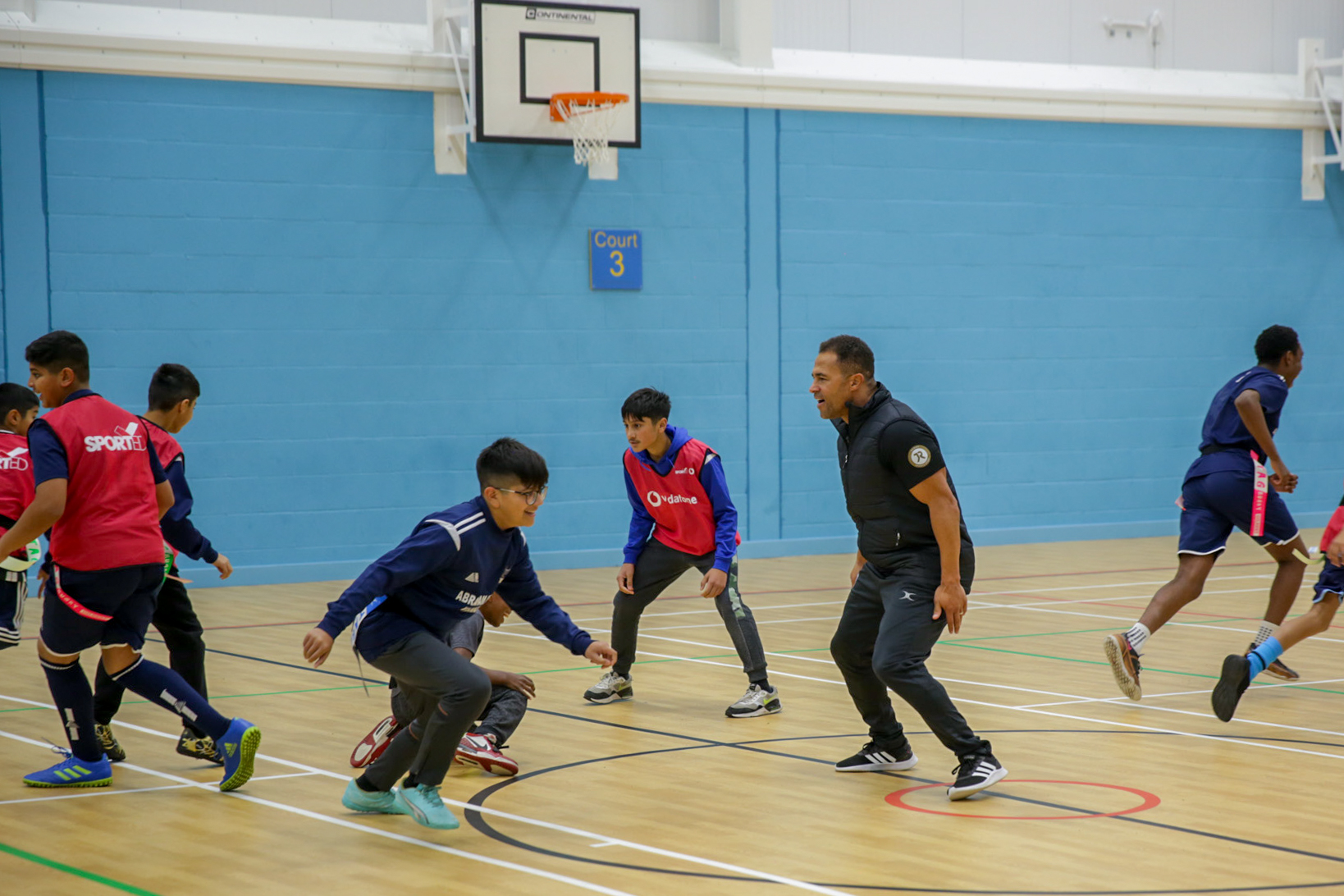 photo of schoolchildren participating in sport with Jason Robinson at the Abraham Moss Warriors club, Manchester