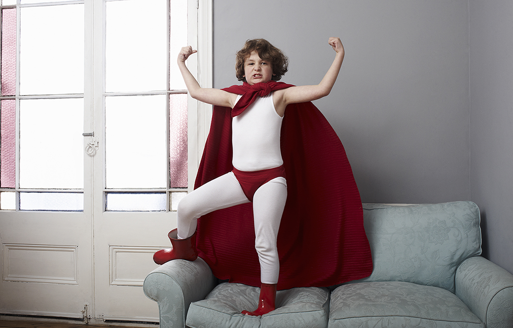 Portrait of a boy dressed as a superhero