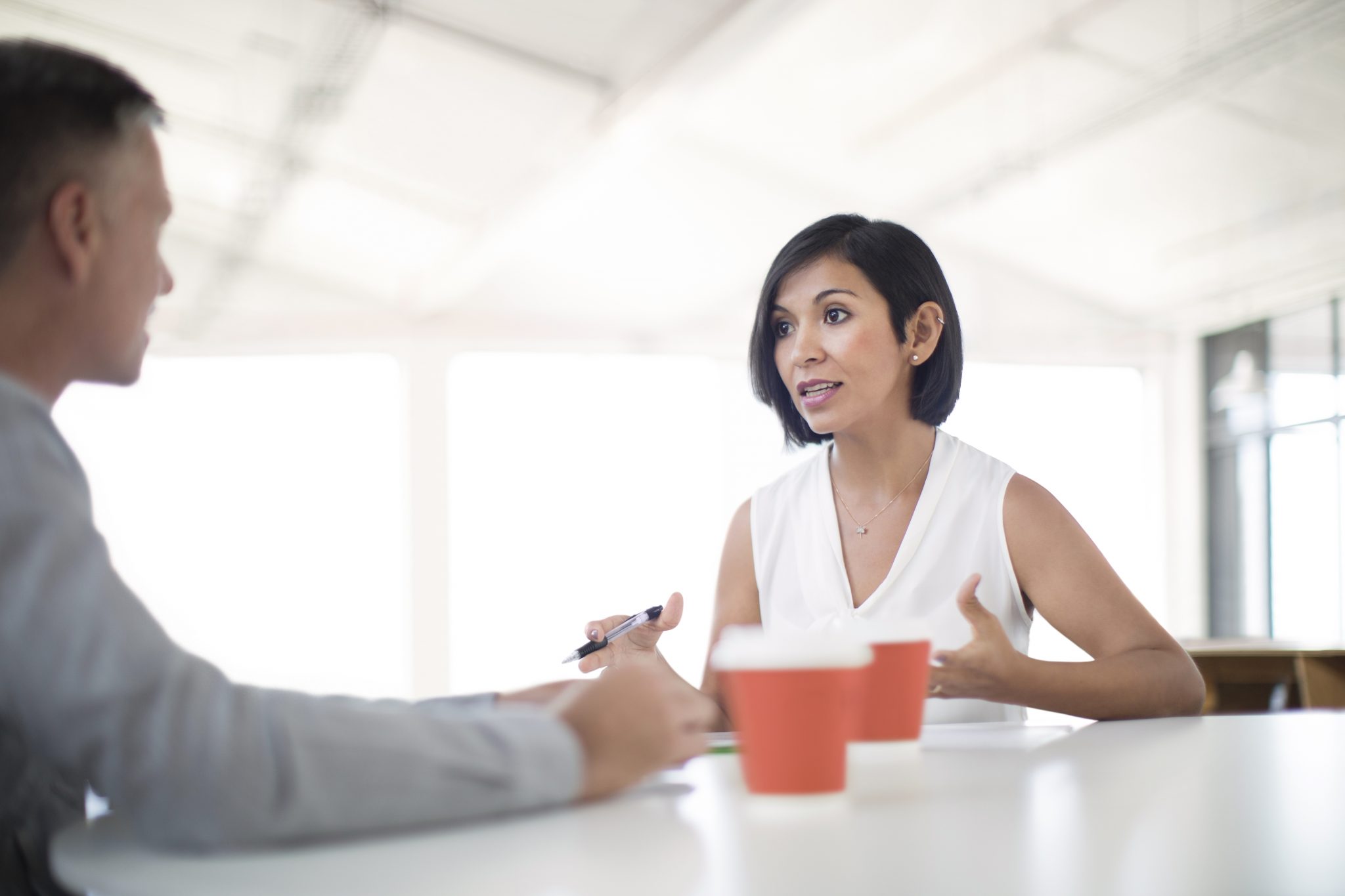 Informal business meeting in open office