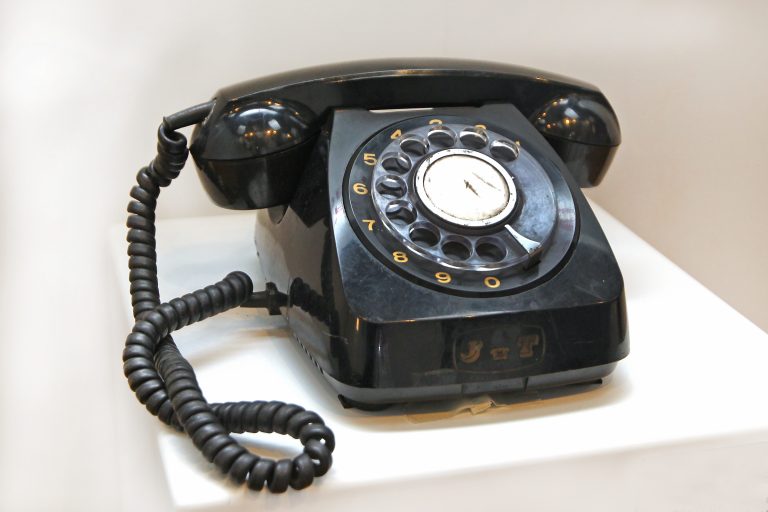 Old-style circular dial telephone