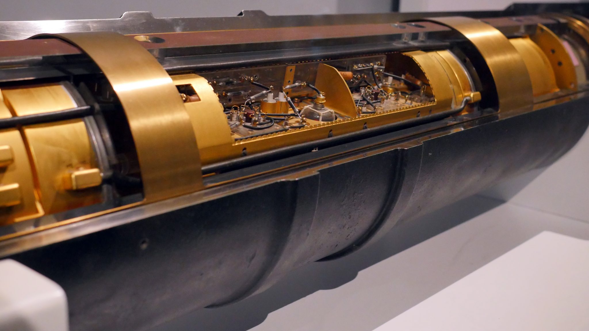 The first-ever transatlantic phone cable, the TAT-1. photo of an in-line signal booster/repeater in the first-ever transatlantic phone cable