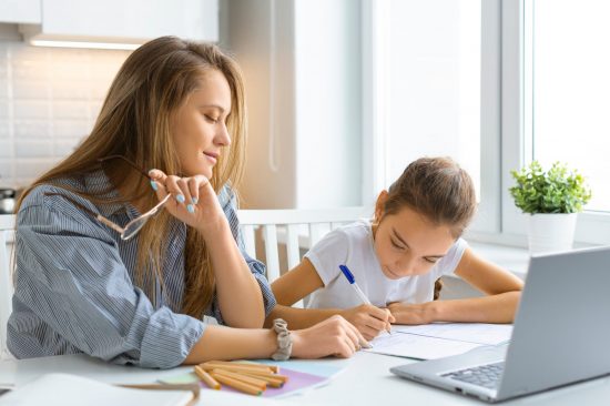 Mum and daughter homeschooling