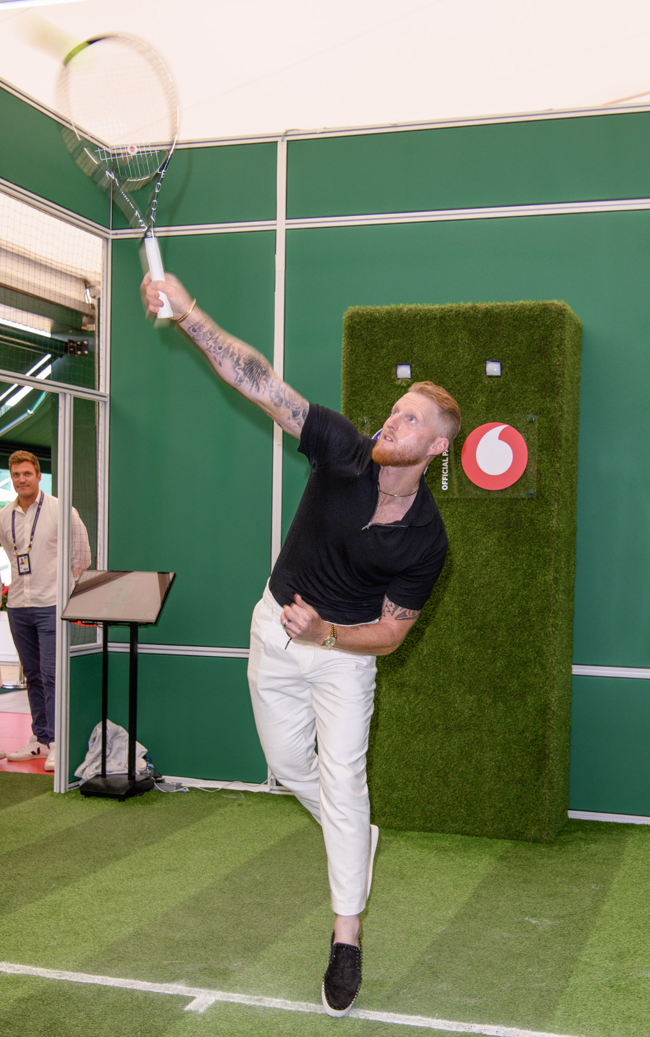 photo of Ben Stokes playing the Vodafone Connection Experience game in the Southern Village at Wimbledon 2023.