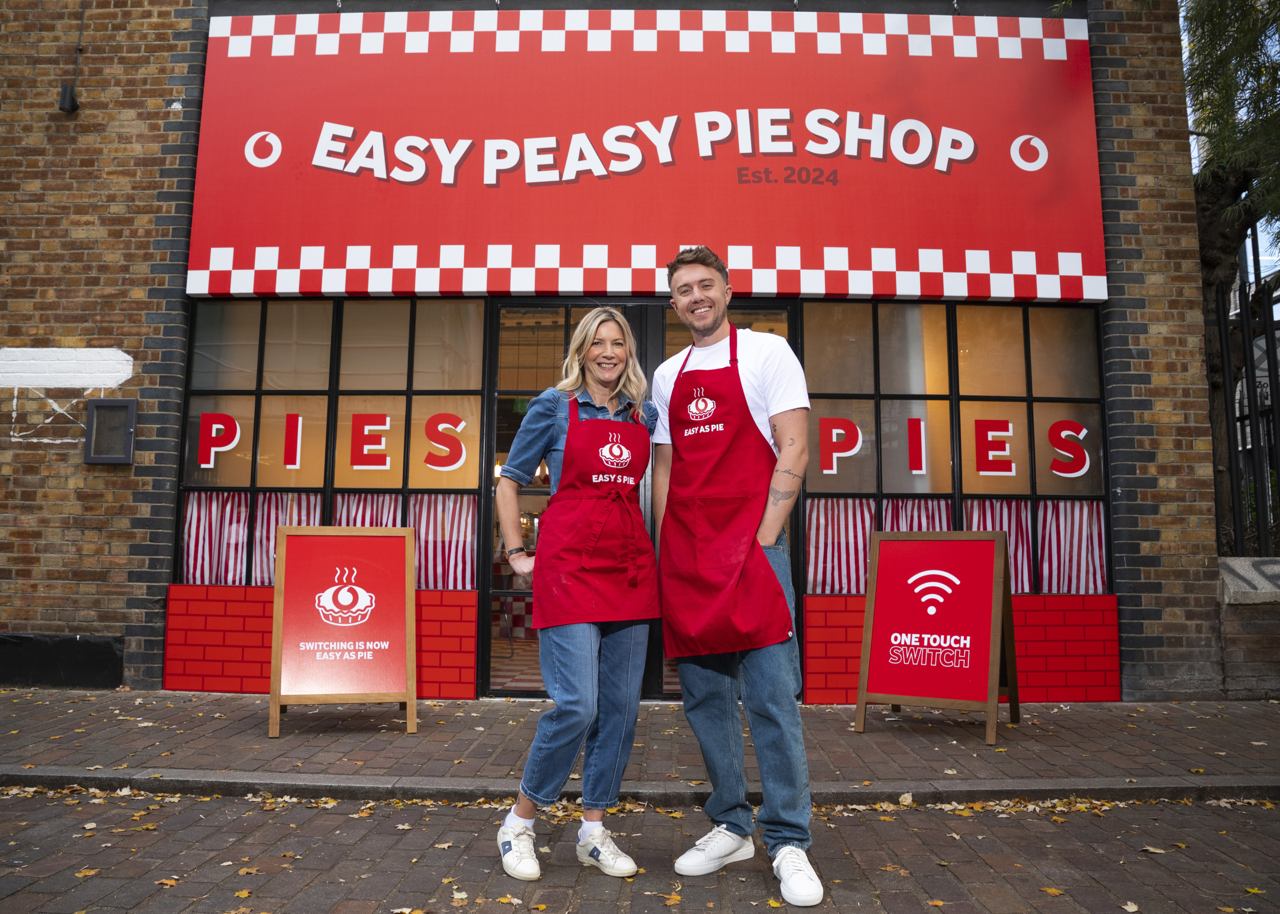 Vodafone opens its Easy Peasy Pie Shop with broadcaster Roman Kemp and easy-cooking advocate, Lisa Faulkner in London, serving free pies to hungry punters to show that switching to Vodafone Broadband is now ‘easy as pie’ with One Touch Switch.