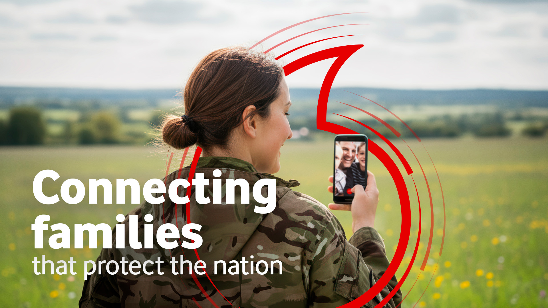 Female armed forces personnel facetiming a loved one, with Vodafone branding.