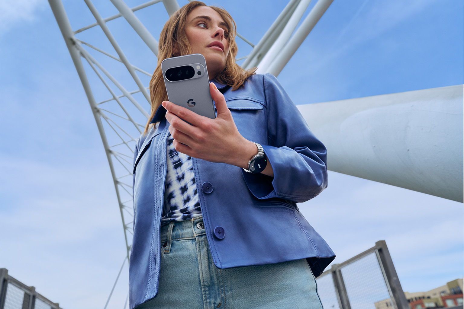 woman using Google Pixel 10 smartphone and Google Pixel Watch 4