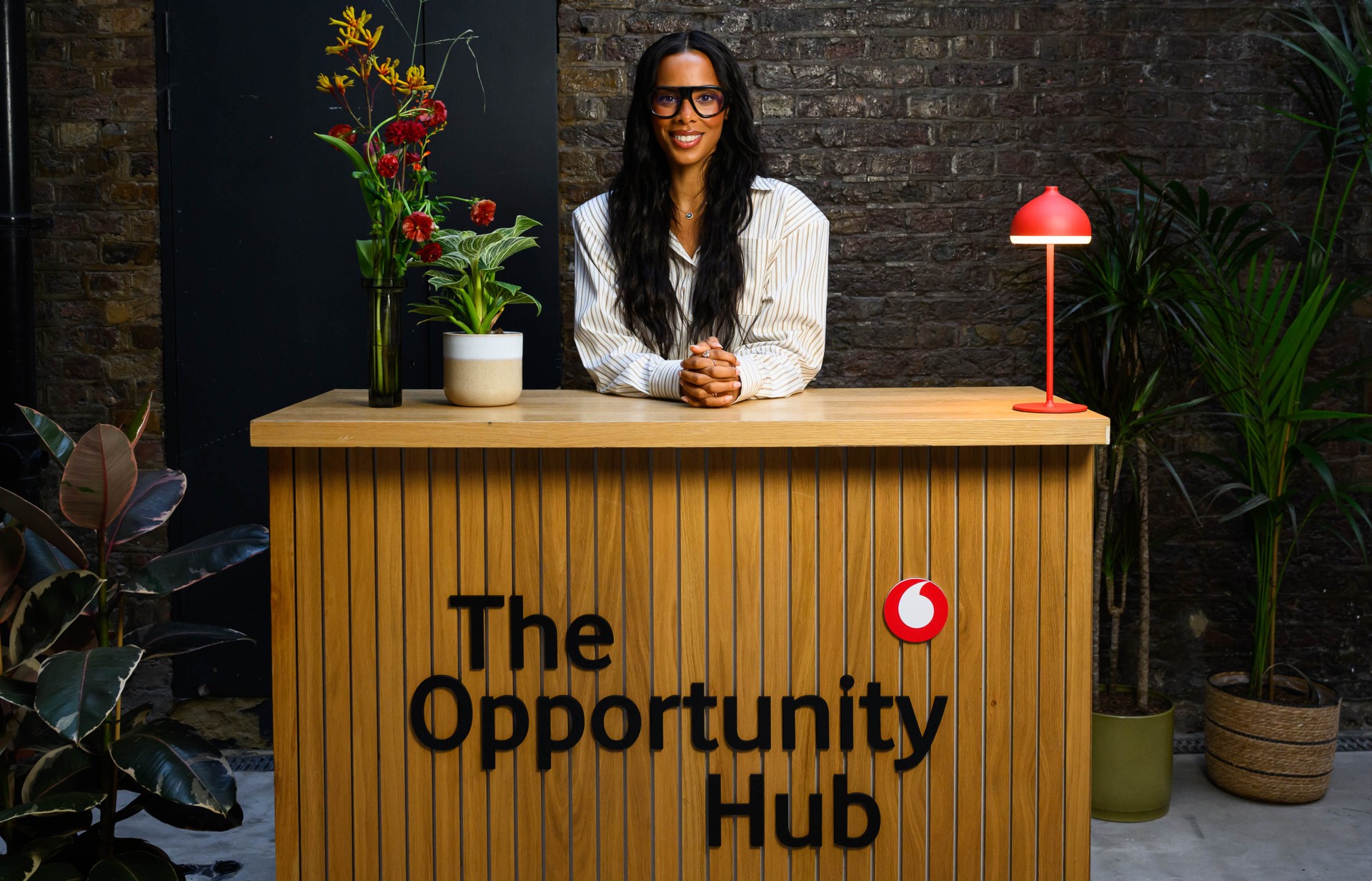 Rochelle Humes sat behind desk at Vodafone's The Opportunity Hub event.