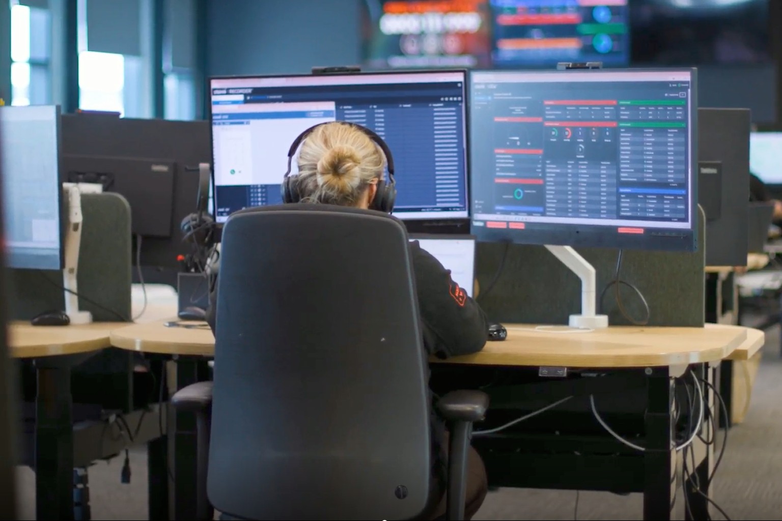 Screenshot 2026-09-14 at 13.37.15 Call centre worker sat infront of two screens at Cadent office.