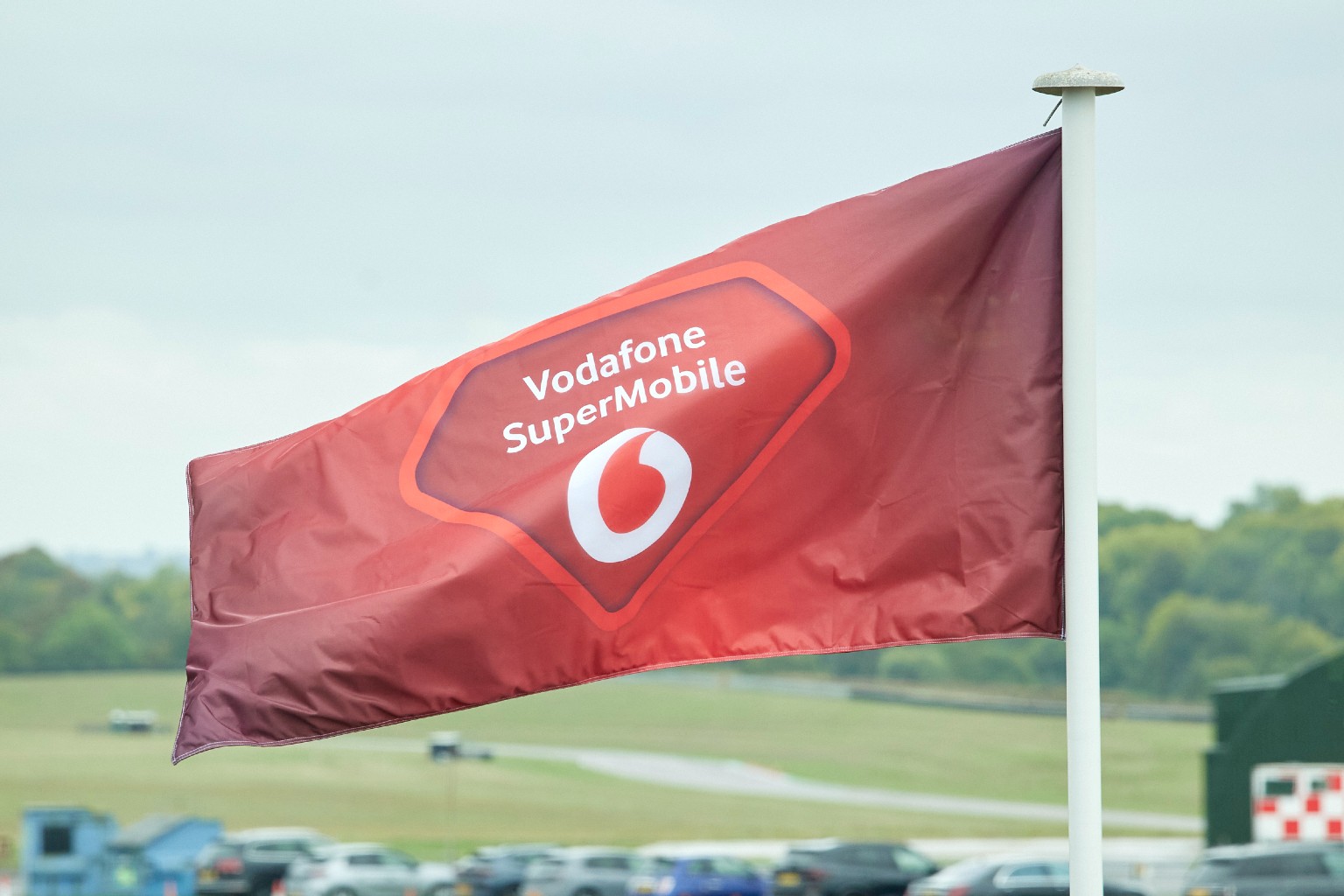 Vodafone SuperMobile logo on flag, blowing in wind.