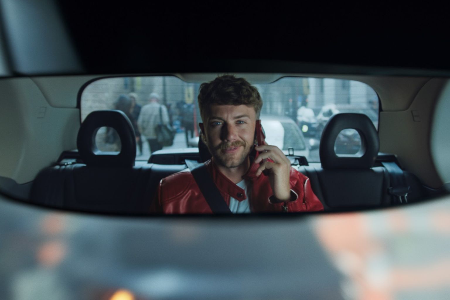 tinywow_Still 1_91613264 Roman Kemp in car with phone to ear, as featured in Vodafone SuperMobile TV advert.
